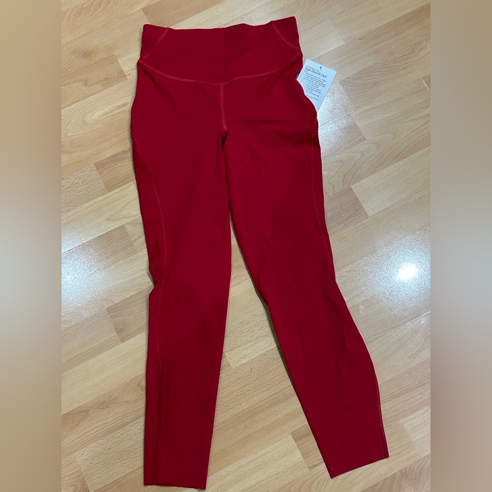 New Lululemon Base Pace leggings in dark red